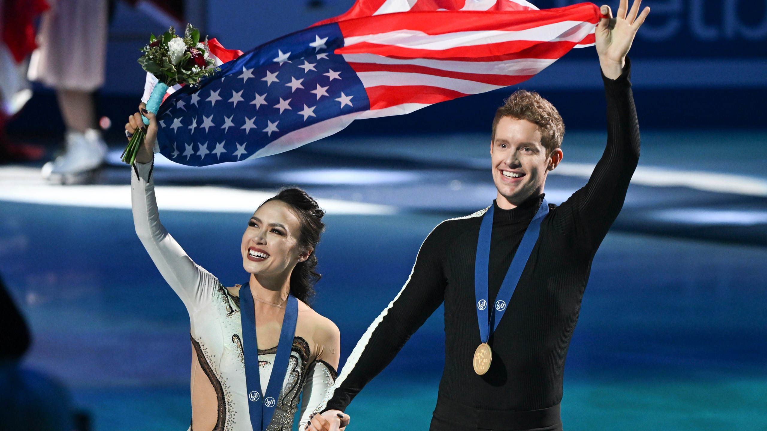 FILE - Madison Chock and Evan Bates, of the United States, wave to fans as they celebrate their victory in the ice dance competition at the ISU World Figure Skating Championships in Montreal, March 23, 2024. (Graham Hughes/The Canadian Press via AP, File)