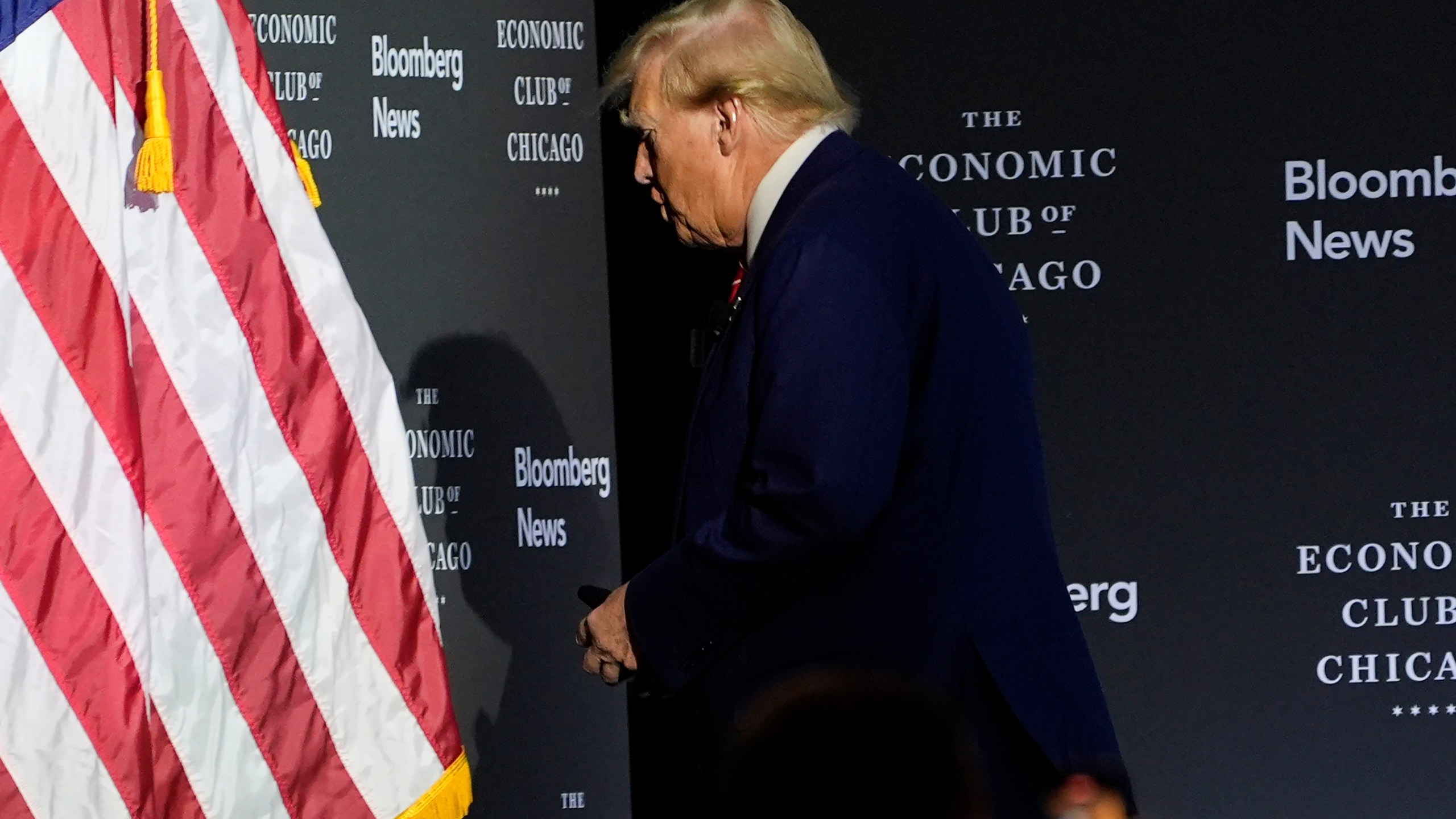 Republican presidential nominee former President Donald Trump walks off after an interview with Bloomberg News Editor-in-Chief John Micklethwait during an event with the Economic Club of Chicago, Tuesday, Oct. 15, 2024, in Chicago. (AP Photo/Evan Vucci)