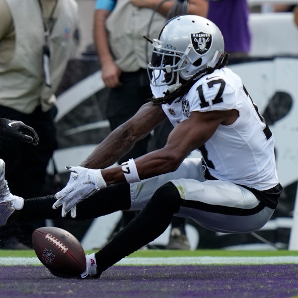 Las Vegas Raiders wide receiver Davante Adams (17) misses a catch attempt against the Baltimore Ravens during the second half of an NFL football game, Sunday, Sept. 15, 2024, in Baltimore. (AP Photo/Stephanie Scarbrough)