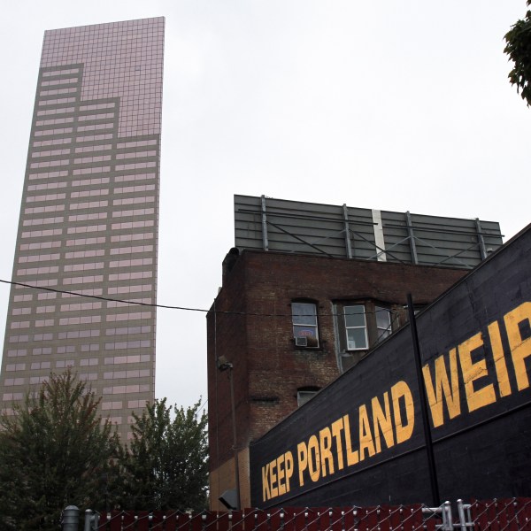 FILE - A downtown building displays a popular slogan in relation to the city in Portland, Ore., Sept. 19, 2012. (AP Photo/Don Ryan, File)