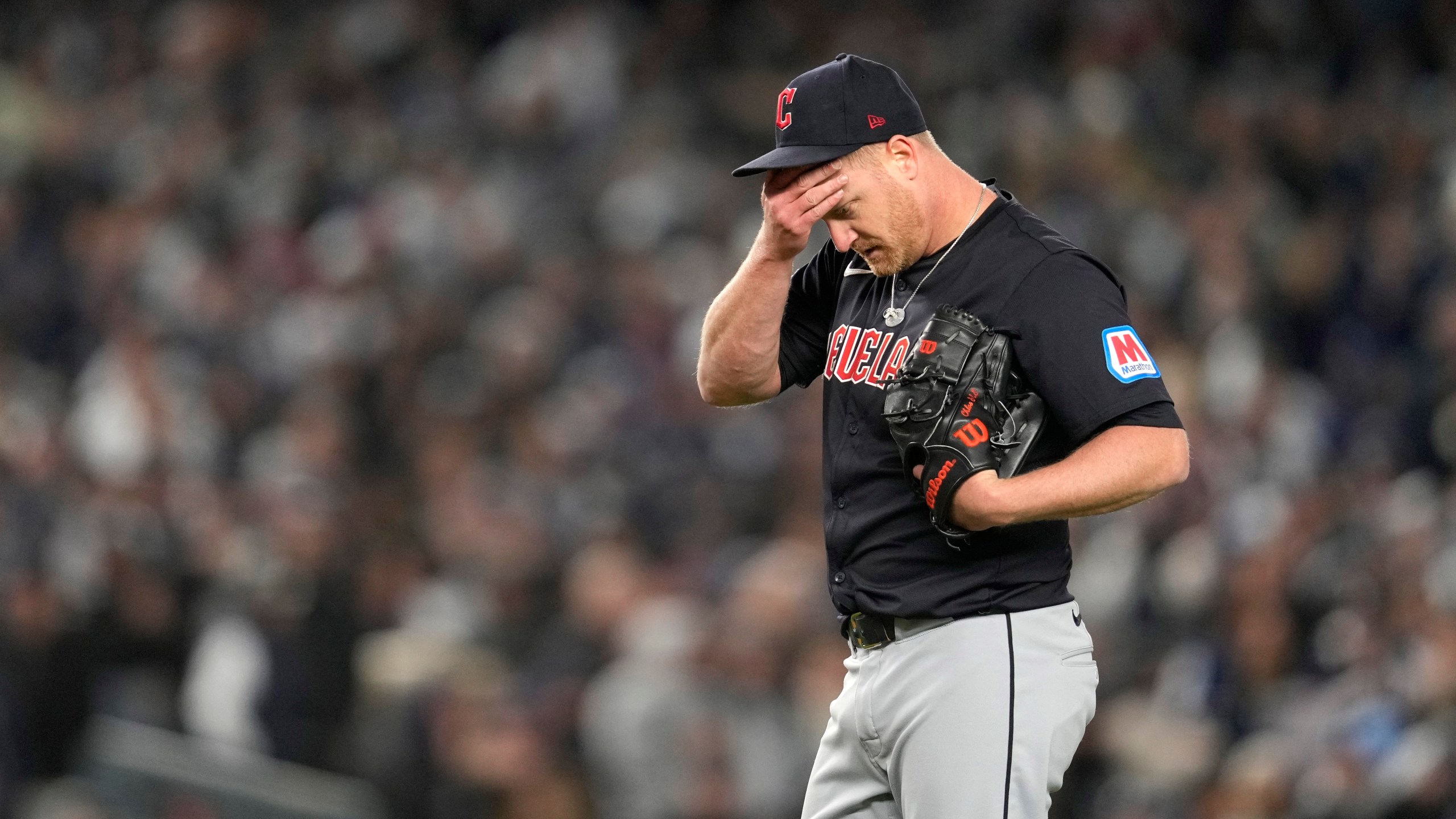 Cleveland Guardians starting pitcher Alex Cobb reacts after walking New York Yankees' Anthony Volpe during the third inning in Game 1 of the baseball AL Championship Series Monday, Oct. 14, 2024, in New York. (AP Photo/Godofredo Vásquez)