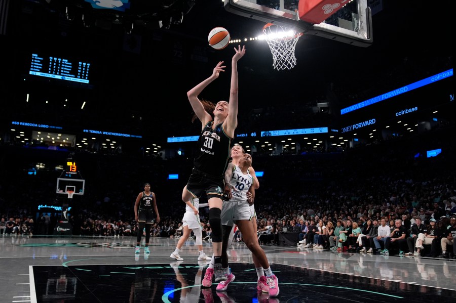 New York Liberty's Breanna Stewart (30) shoots during the first half in Game 2 of a WNBA basketball final playoff series against the Minnesota Lynx, Sunday, Oct. 13, 2024, in New York. (AP Photo/Pamela Smith)