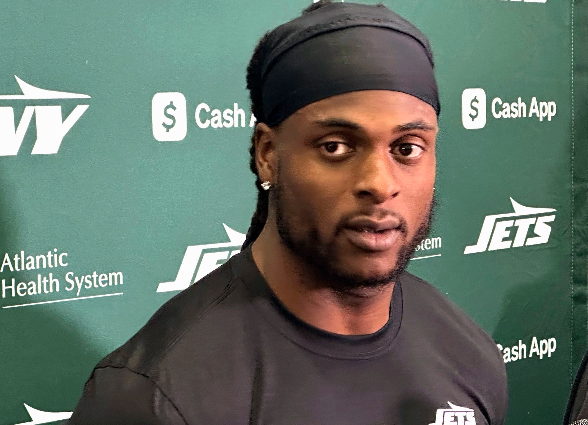 New York Jets wide receiver Davante Adams speaks to reporters at the team's facility in Florham Park, N.J., on Wednesday, Oct. 16, 2024. (AP Photo/Dennis Waszak Jr.)