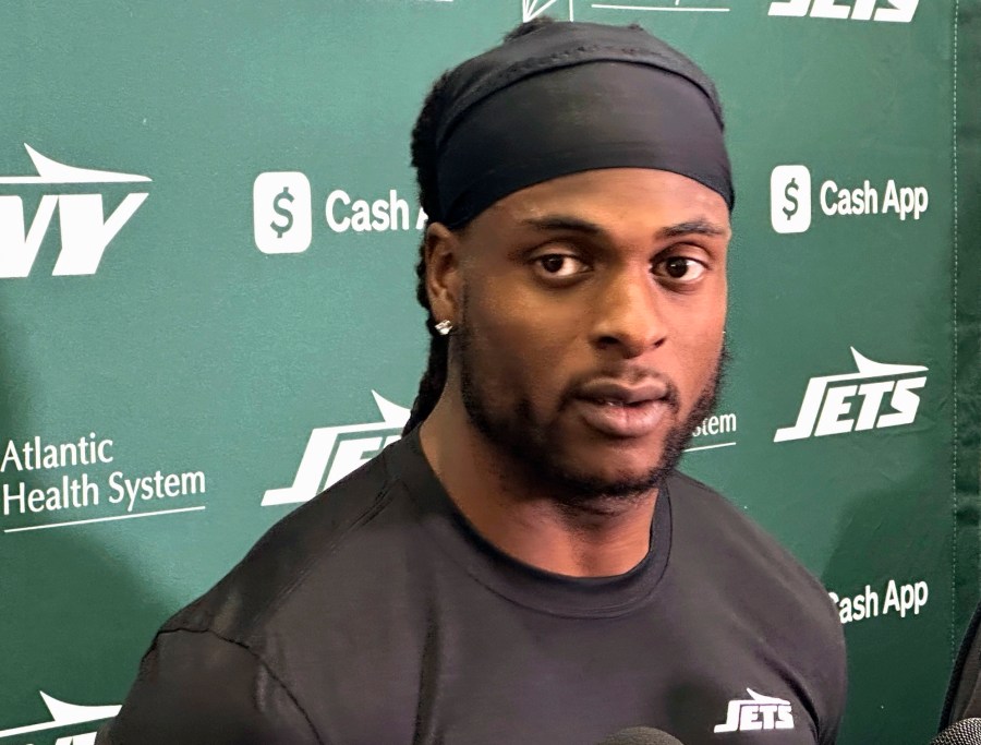 New York Jets wide receiver Davante Adams speaks to reporters at the team's facility in Florham Park, N.J., on Wednesday, Oct. 16, 2024. (AP Photo/Dennis Waszak Jr.)