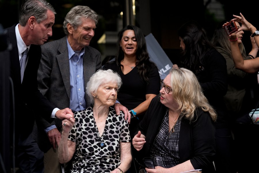 Kitty Menendez' sister, Joan Andersen VanderMolen, bottom left, and niece Karen VanderMolen, right, sit together during a press conference to announce developments on the case of brothers Erik and Lyle Menendez, Wednesday, Oct. 16, 2024, in Los Angeles. (AP Photo/Damian Dovarganes)