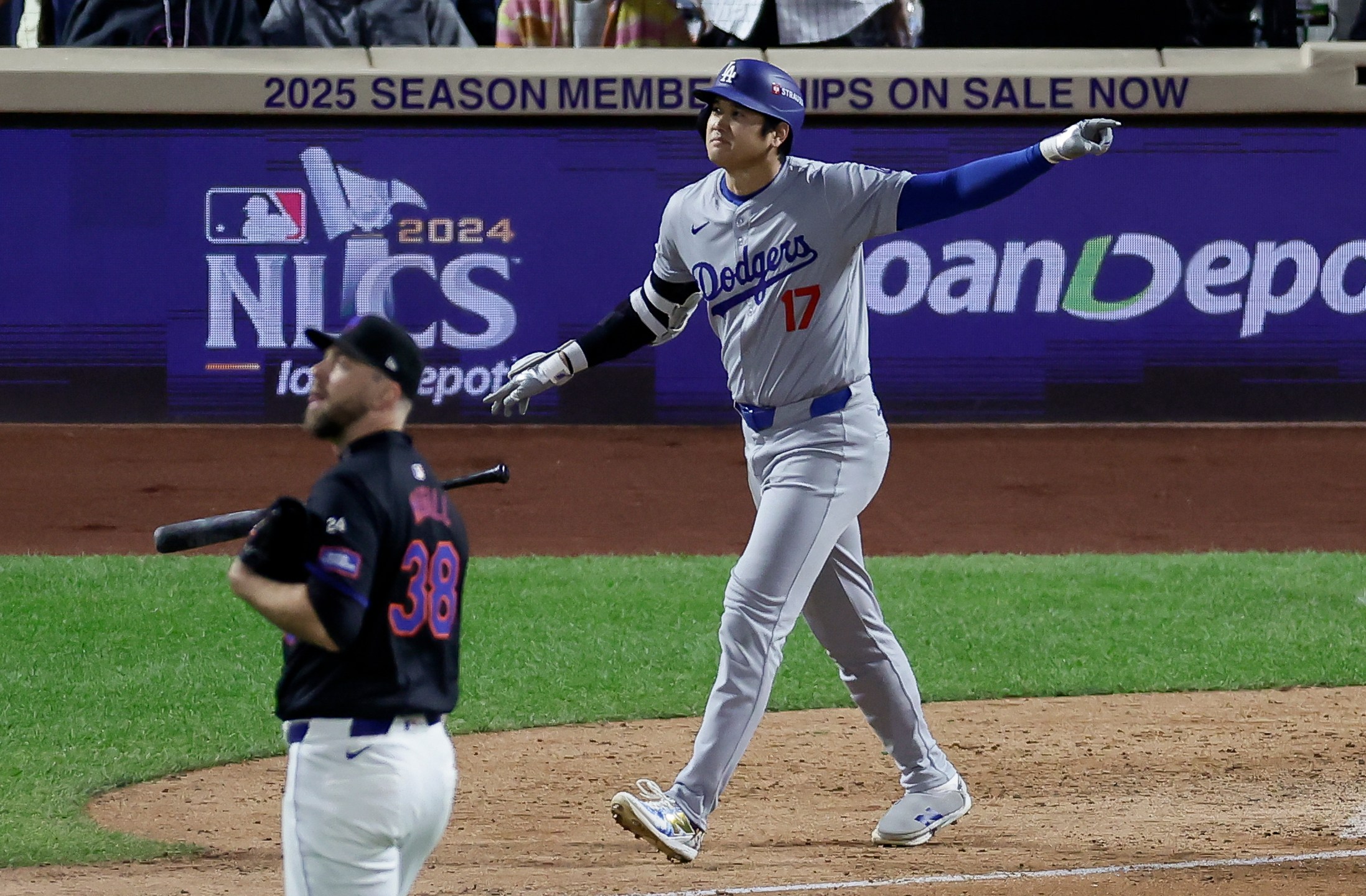 Los Angeles Dodgers' Shohei Ohtani celebrates his three-run home run against the New York Mets during the eighth inning in Game 3 of a baseball NL Championship Series, Wednesday, Oct. 16, 2024, in New York. (AP Photo/Adam Hunger)