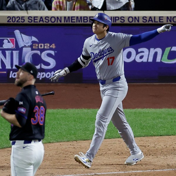 Los Angeles Dodgers' Shohei Ohtani celebrates his three-run home run against the New York Mets during the eighth inning in Game 3 of a baseball NL Championship Series, Wednesday, Oct. 16, 2024, in New York. (AP Photo/Adam Hunger)