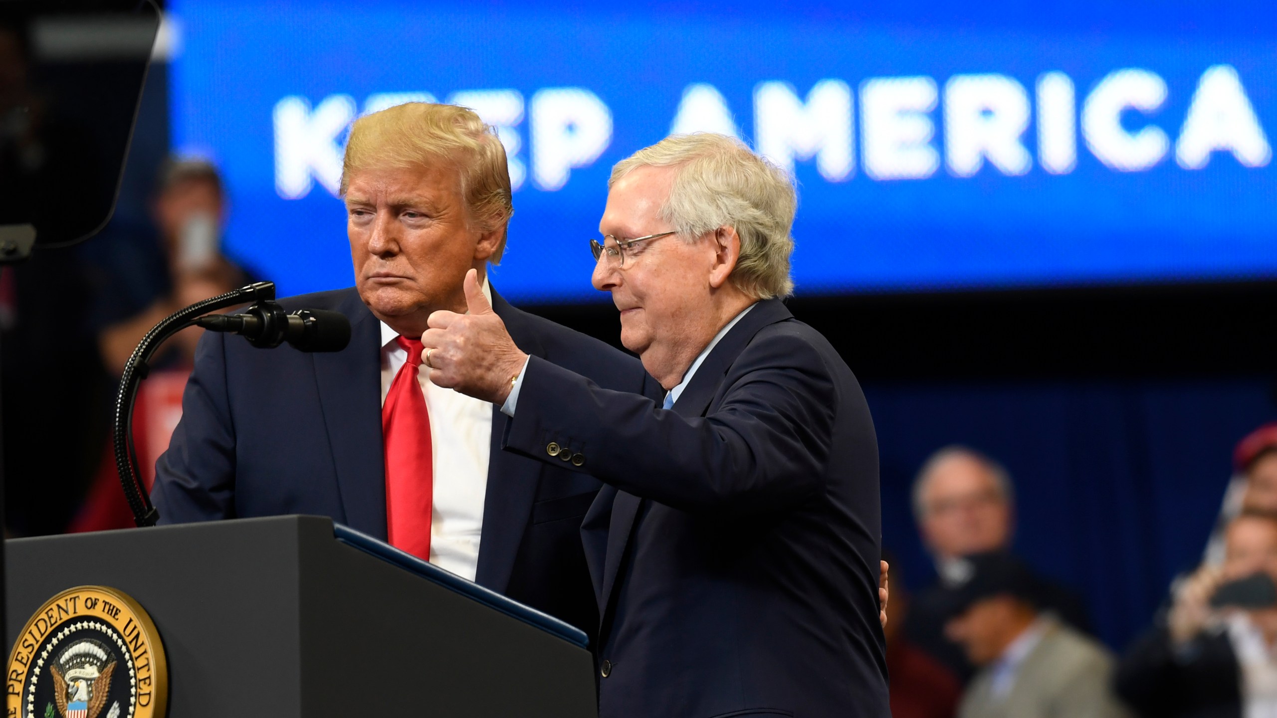 FILE - President Donald Trump brings Senate Majority Leader Mitch McConnell of Ky., on stage during a campaign rally in Lexington, Ky., Nov. 4, 2019. (AP Photo/Susan Walsh, File)