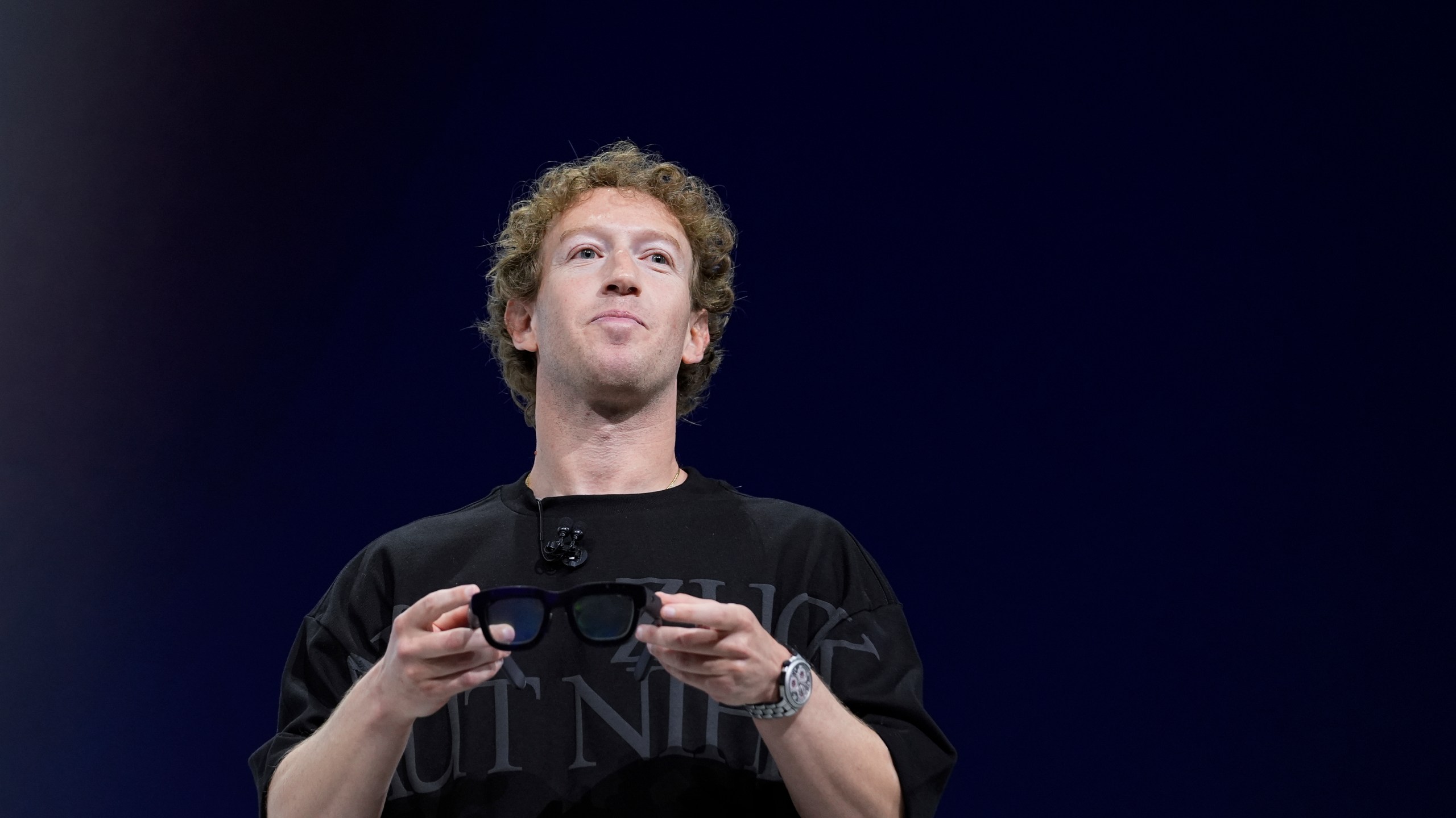 FILE - Mark Zuckerberg holds a pair of Orion AR glasses during the Meta Connect conferenceSept. 25, 2024, in Menlo Park, Calif. (AP Photo/Godofredo A. Vásquez, File)