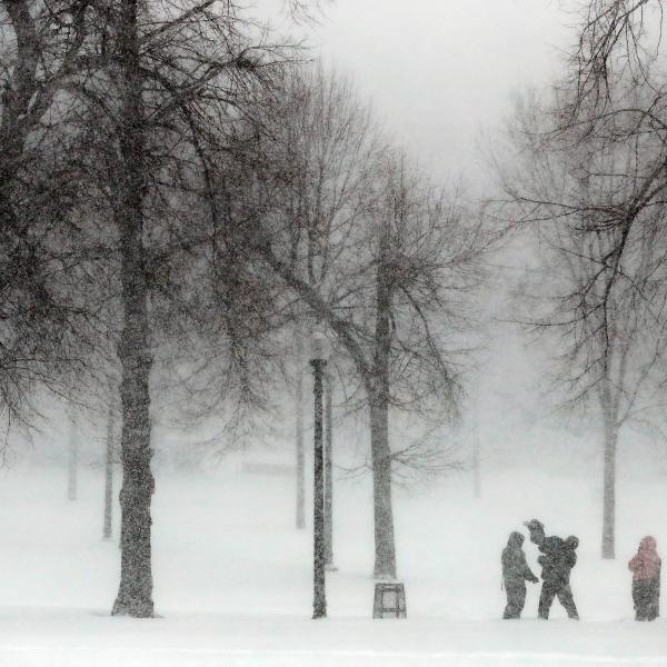 FILE - Snow falls on Boston Common, Saturday, Jan. 29, 2022, in Boston. (AP Photo/Michael Dwyer, File)