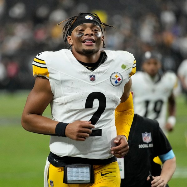 Pittsburgh Steelers quarterback Justin Fields (2) smiles as he jogs off the field after an NFL football game against the Las Vegas Raiders in Las Vegas, Sunday, Oct. 13, 2024. (AP Photo/John Locher)