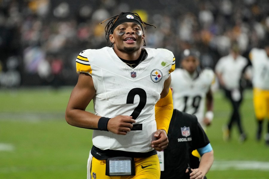 Pittsburgh Steelers quarterback Justin Fields (2) smiles as he jogs off the field after an NFL football game against the Las Vegas Raiders in Las Vegas, Sunday, Oct. 13, 2024. (AP Photo/John Locher)