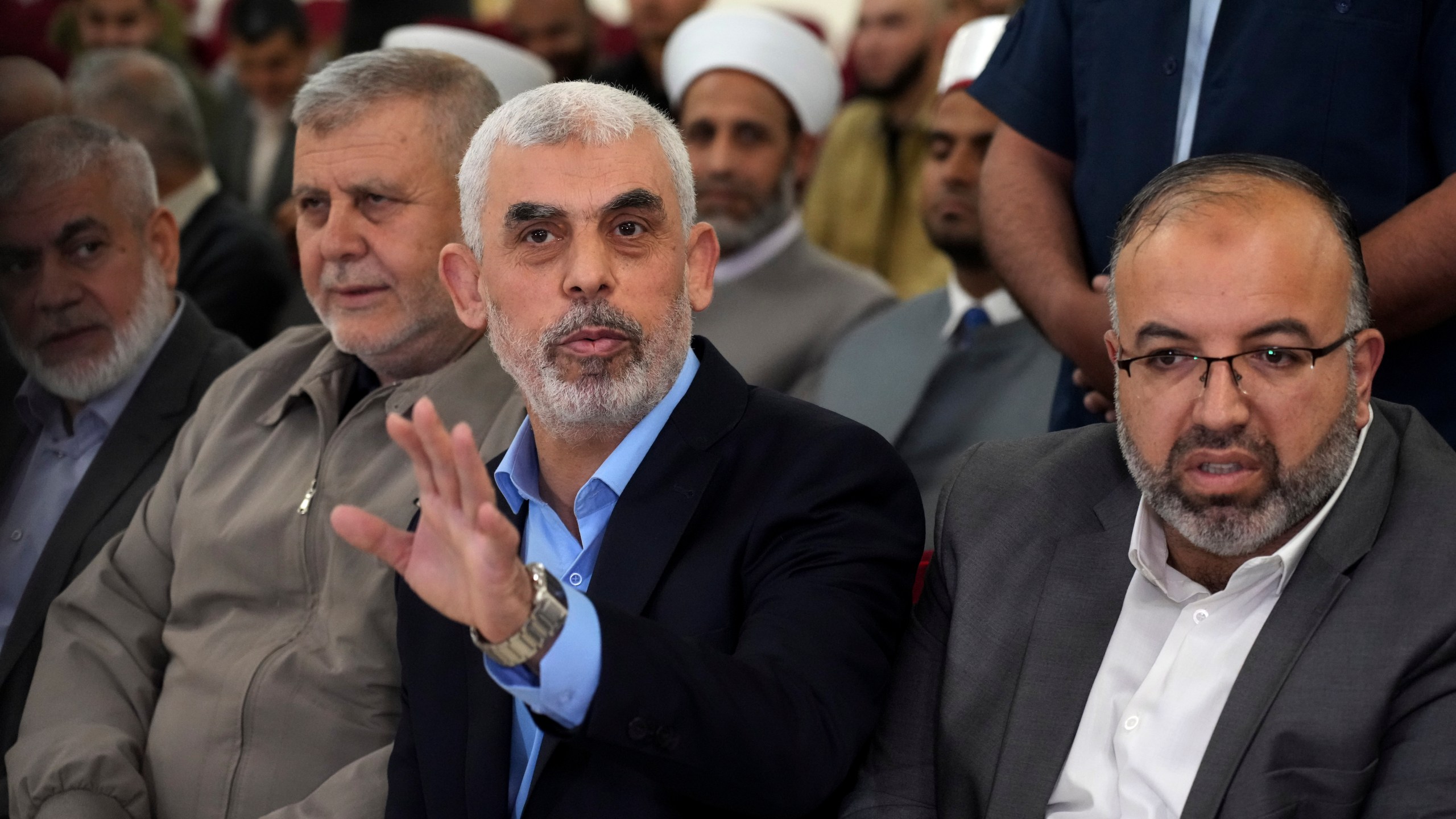 FILE - Yahya Sinwar, head of Hamas in Gaza, greets his supporters upon his arrival at a meeting on the seaside of Gaza City, on April 30, 2022. (AP Photo/Adel Hana, File)