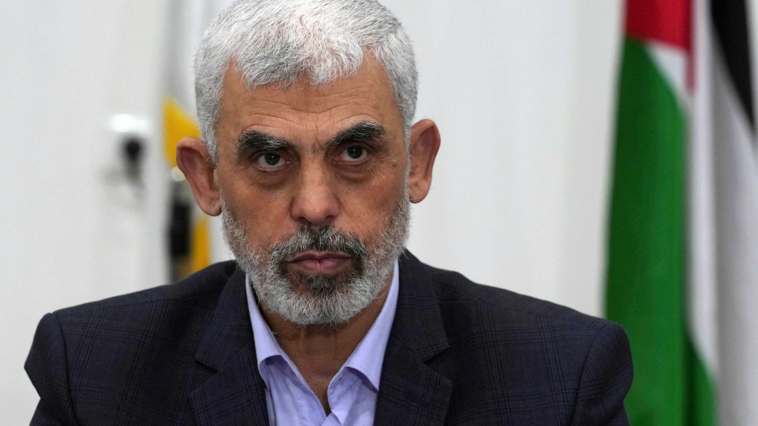 FILE - Yahya Sinwar, head of Hamas in Gaza, chairs a meeting with leaders of Palestinian factions at his office in Gaza City, on April 13, 2022. (AP Photo/Adel Hana, File)