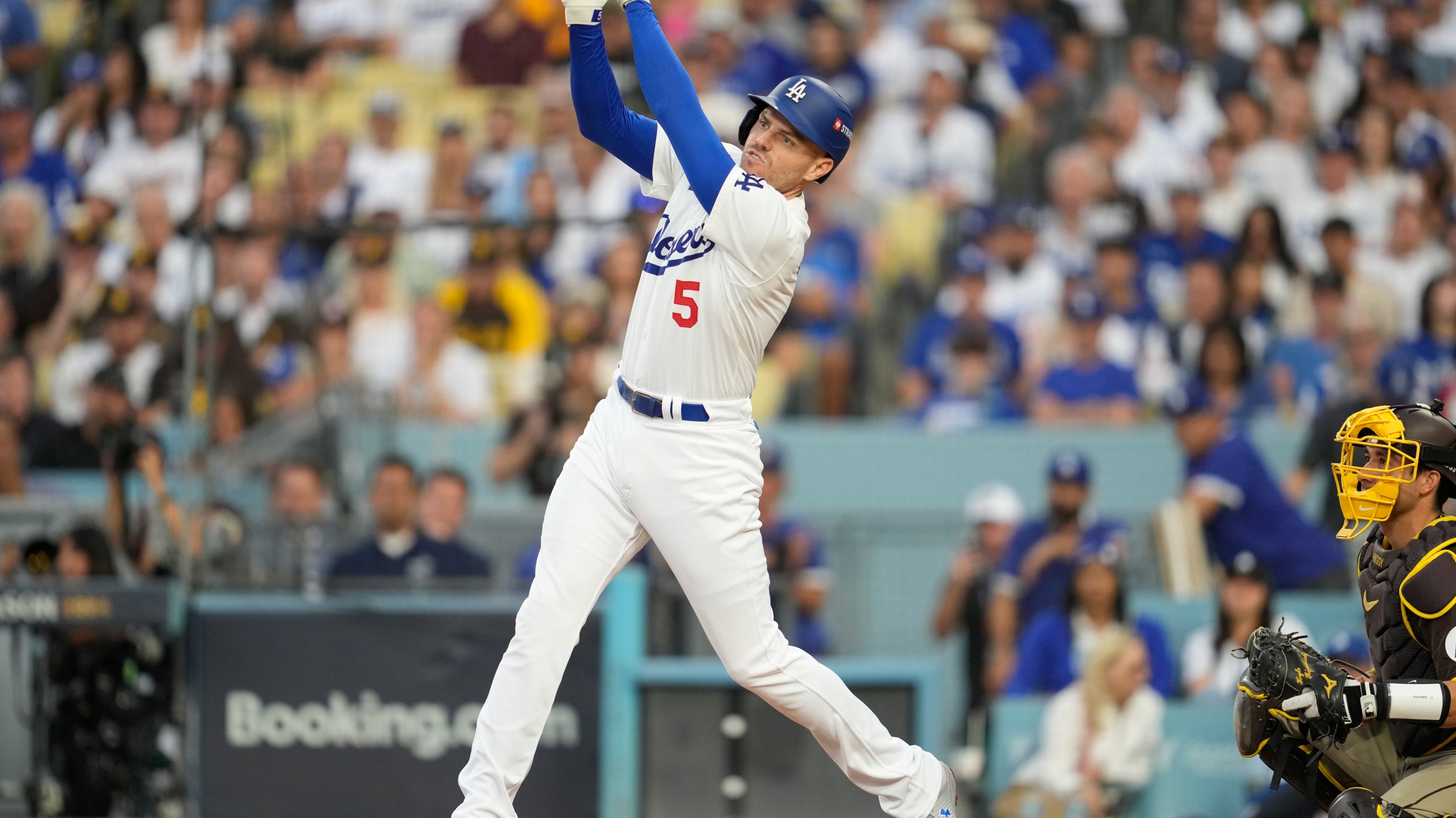 Los Angeles Dodgers' Freddie Freeman flies out during the fourth inning in Game 5 of a baseball NL Division Series against the San Diego Padres, Friday, Oct. 11, 2024, in Los Angeles. (AP Photo/Ashley Landis)