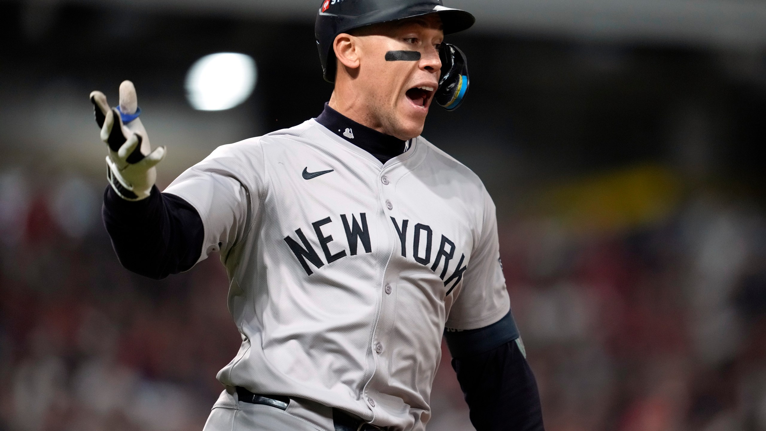 New York Yankees' Aaron Judge celebrates after hitting a two-run home run against the Cleveland Guardians during the eighth inning in Game 3 of the baseball AL Championship Series Thursday, Oct. 17, 2024, in Cleveland.(AP Photo/Godofredo Vásquez )