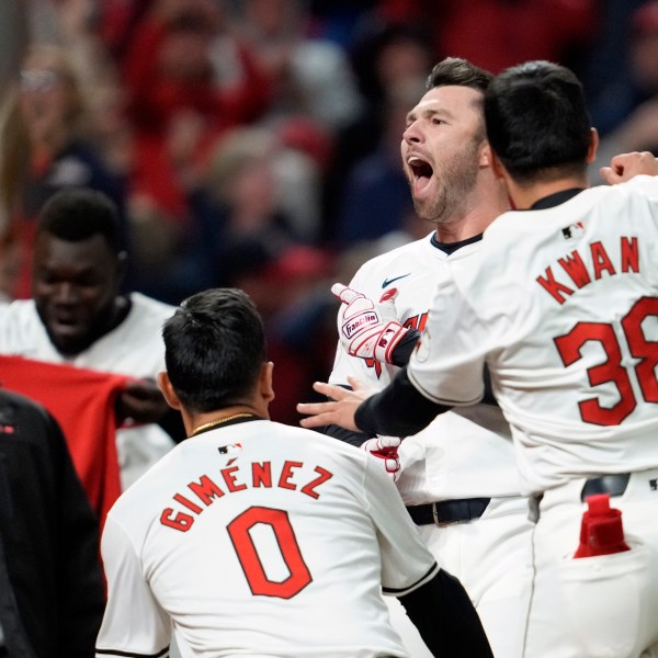 Cleveland Guardians' David Fry, second from right, celebrates with teammates after hitting a game-winning two-run home run against the New York Yankees during the 10th inning in Game 3 of the baseball AL Championship Series Thursday, Oct. 17, 2024, in Cleveland. The Guardians won 7-5. (AP Photo/Godofredo Vásquez )