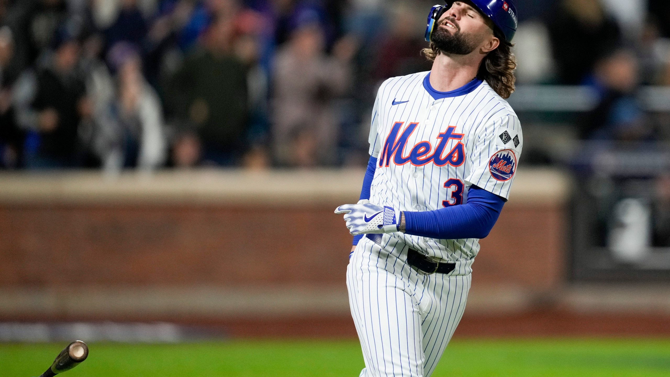 New York Mets' Jesse Winker reacts after flying out against the Los Angeles Dodgers during the sixth inning in Game 4 of a baseball NL Championship Series, Thursday, Oct. 17, 2024, in New York. (AP Photo/Ashley Landis)