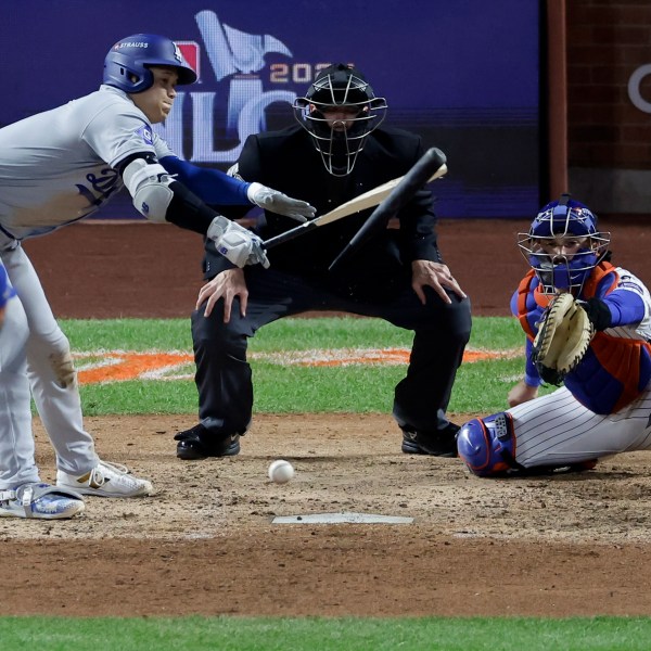 Los Angeles Dodgers' Shohei Ohtani breaks his bat and grounds out against the New York Mets during the seventh inning in Game 4 of a baseball NL Championship Series, Thursday, Oct. 17, 2024, in New York. (AP Photo/Adam Hunger)