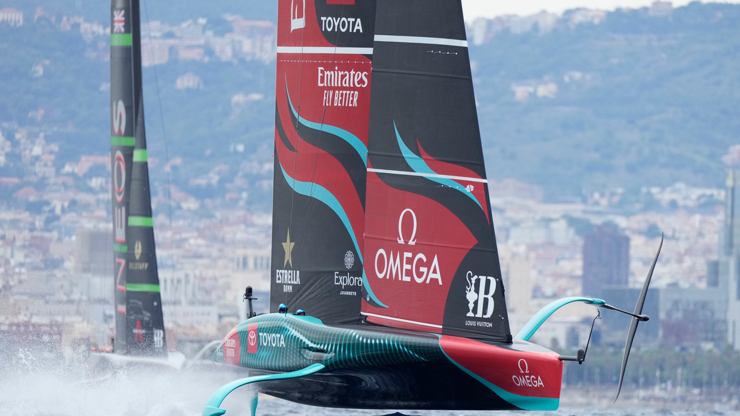 Ineos Britannia and Emirates Team New Zealand race during Louis Vuitton 37th America's Cup Day 5 race 8 in Barcelona, Spain, Friday, Oct. 18, 2024. (AP Photo/Bernat Armangue)