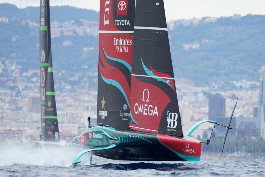 Ineos Britannia and Emirates Team New Zealand race during Louis Vuitton 37th America's Cup Day 5 race 8 in Barcelona, Spain, Friday, Oct. 18, 2024. (AP Photo/Bernat Armangue)