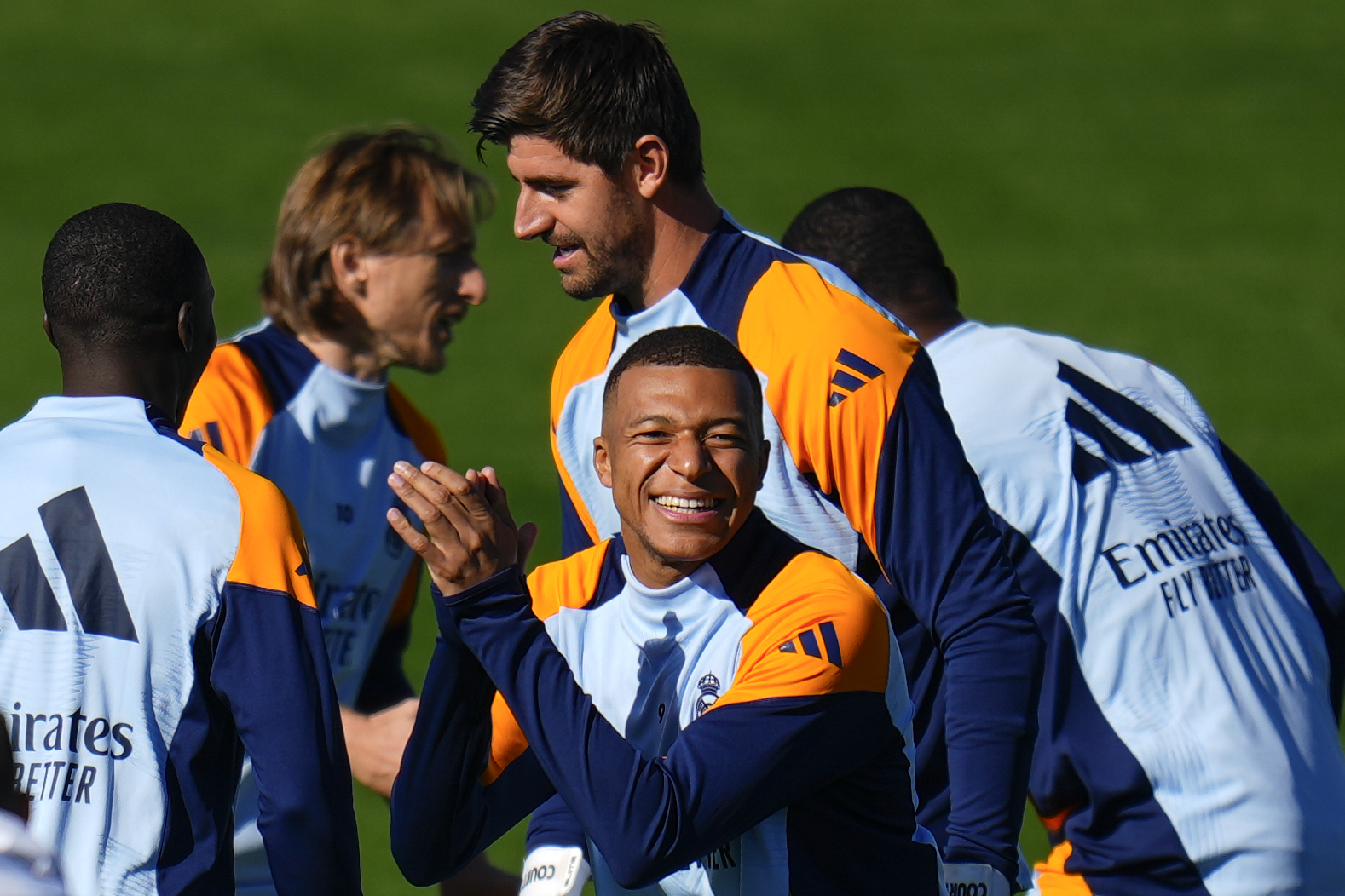 Real Madrid's Kylian Mbappe, center, gestures during a training session with his teammates at Real Madrid's Valdebebas training ground in Madrid, Spain, Friday, Oct. 18, 2024. (AP Photo/Manu Fernandez)