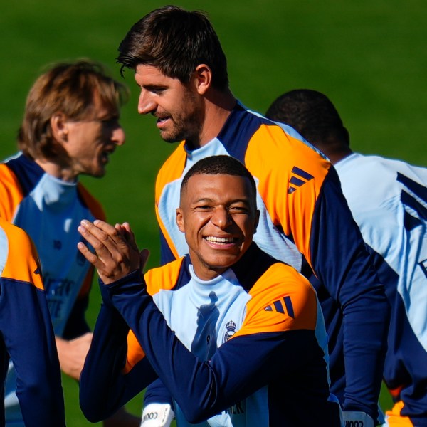 Real Madrid's Kylian Mbappe, center, gestures during a training session with his teammates at Real Madrid's Valdebebas training ground in Madrid, Spain, Friday, Oct. 18, 2024. (AP Photo/Manu Fernandez)