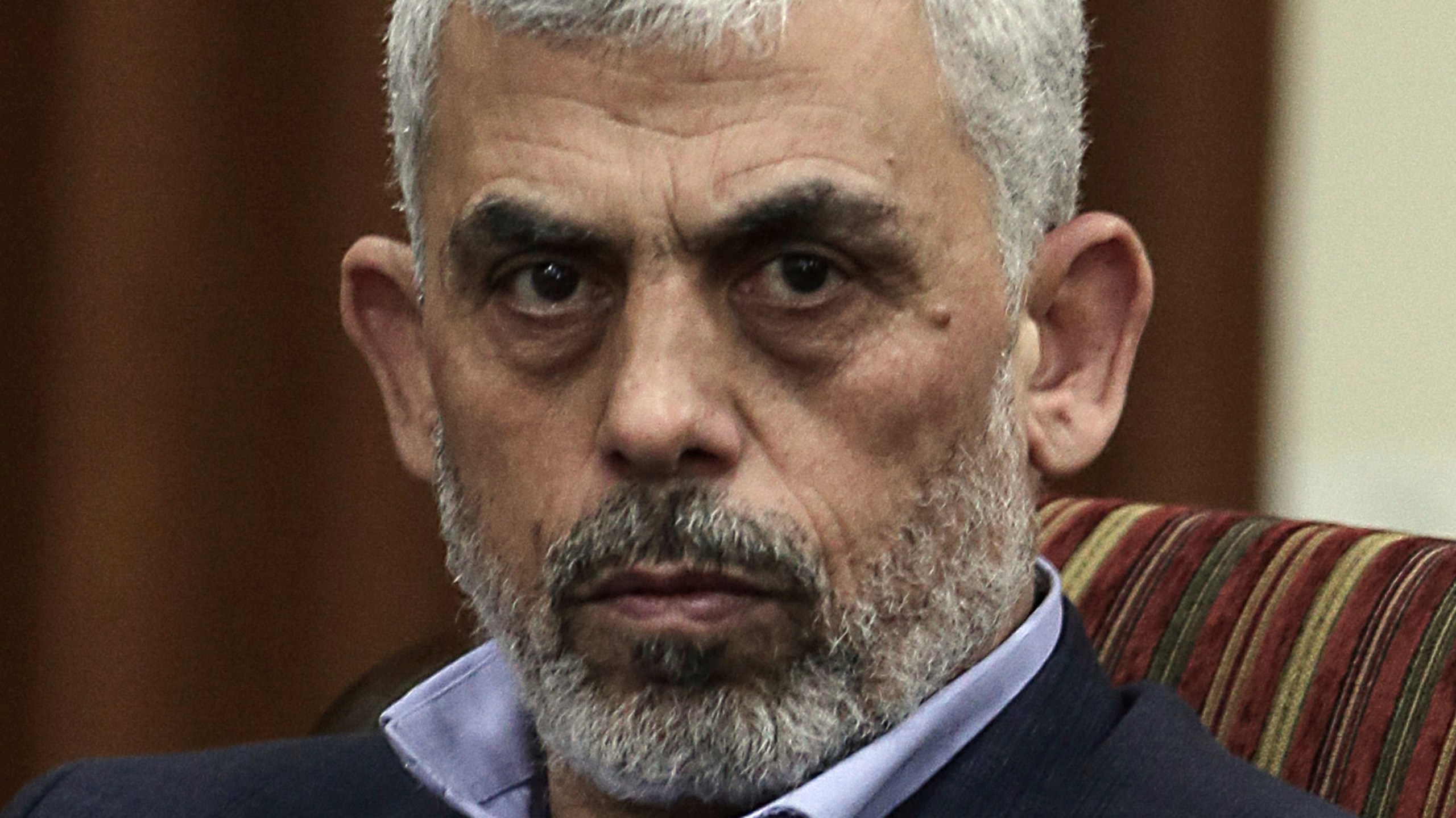 FILE - Hamas leader in the Gaza Strip Yahya Sinwar takes part in a meeting with Egypt's general intelligence chief, Khaled Fawzy and others in Gaza City, on Oct. 3, 2017.(AP Photo/ Khalil Hamra, File)