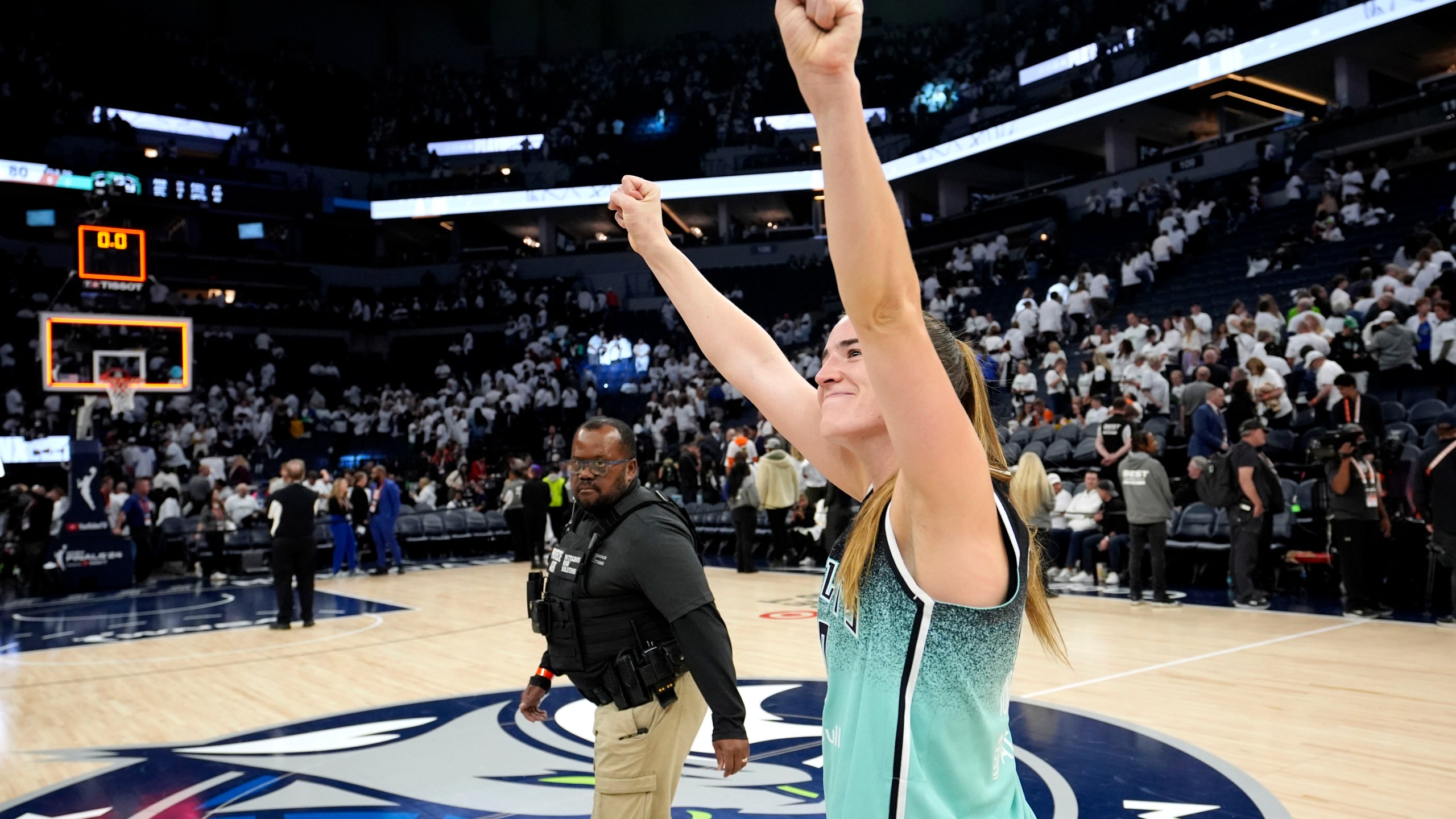 New York Liberty guard Sabrina Ionescu celebrates after Game 3 of a WNBA basketball final playoff series against the Minnesota Lynx, Wednesday, Oct. 16, 2024, in Minneapolis. The Liberty won 80-77. (AP Photo/Abbie Parr)