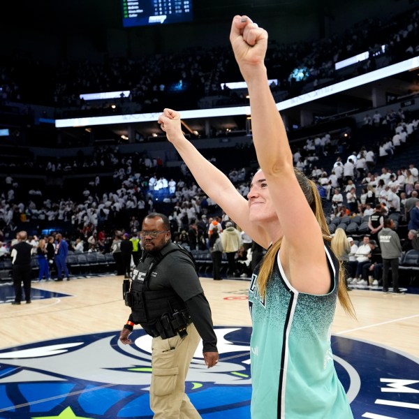 New York Liberty guard Sabrina Ionescu celebrates after Game 3 of a WNBA basketball final playoff series against the Minnesota Lynx, Wednesday, Oct. 16, 2024, in Minneapolis. The Liberty won 80-77. (AP Photo/Abbie Parr)