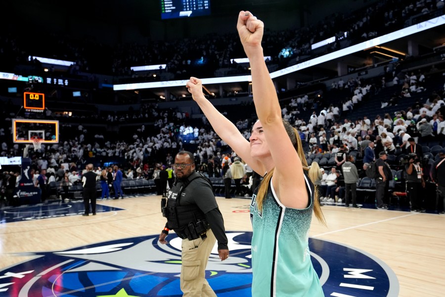 New York Liberty guard Sabrina Ionescu celebrates after Game 3 of a WNBA basketball final playoff series against the Minnesota Lynx, Wednesday, Oct. 16, 2024, in Minneapolis. The Liberty won 80-77. (AP Photo/Abbie Parr)