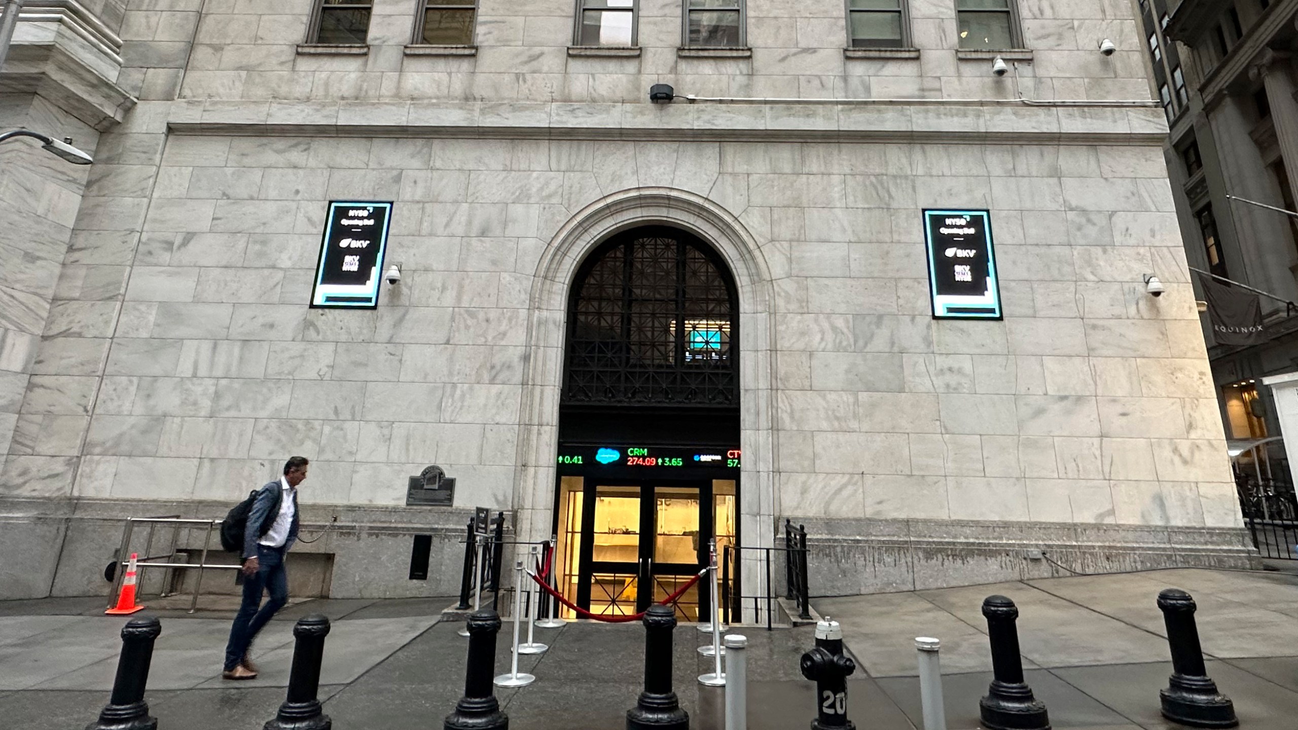 FILE - A man approaches an entrance to the New York Stock Exchange on Sept. 26, 2024, in New York. (AP Photo/Peter Morgan, File)