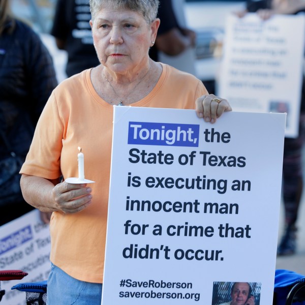 Ann Dorn, a local Catholic parishioner opposed to the death penalty, protest outside the prison where Robert Roberson is scheduled for execution at the Huntsville Unit of the Texas State Penitentiary, Thursday, Oct. 17, 2024, in Huntsville, Texas. (AP Photo/Michael Wyke)