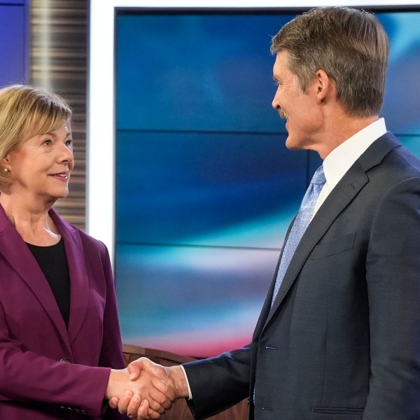 Wisconsin Senate candidates Republican Eric Hovde and Democratic U.S. Sen. Tammy Baldwin shake hands before a televised debate Friday, Oct. 18, 2024, in Madison, Wis. (AP Photo/Morry Gash)