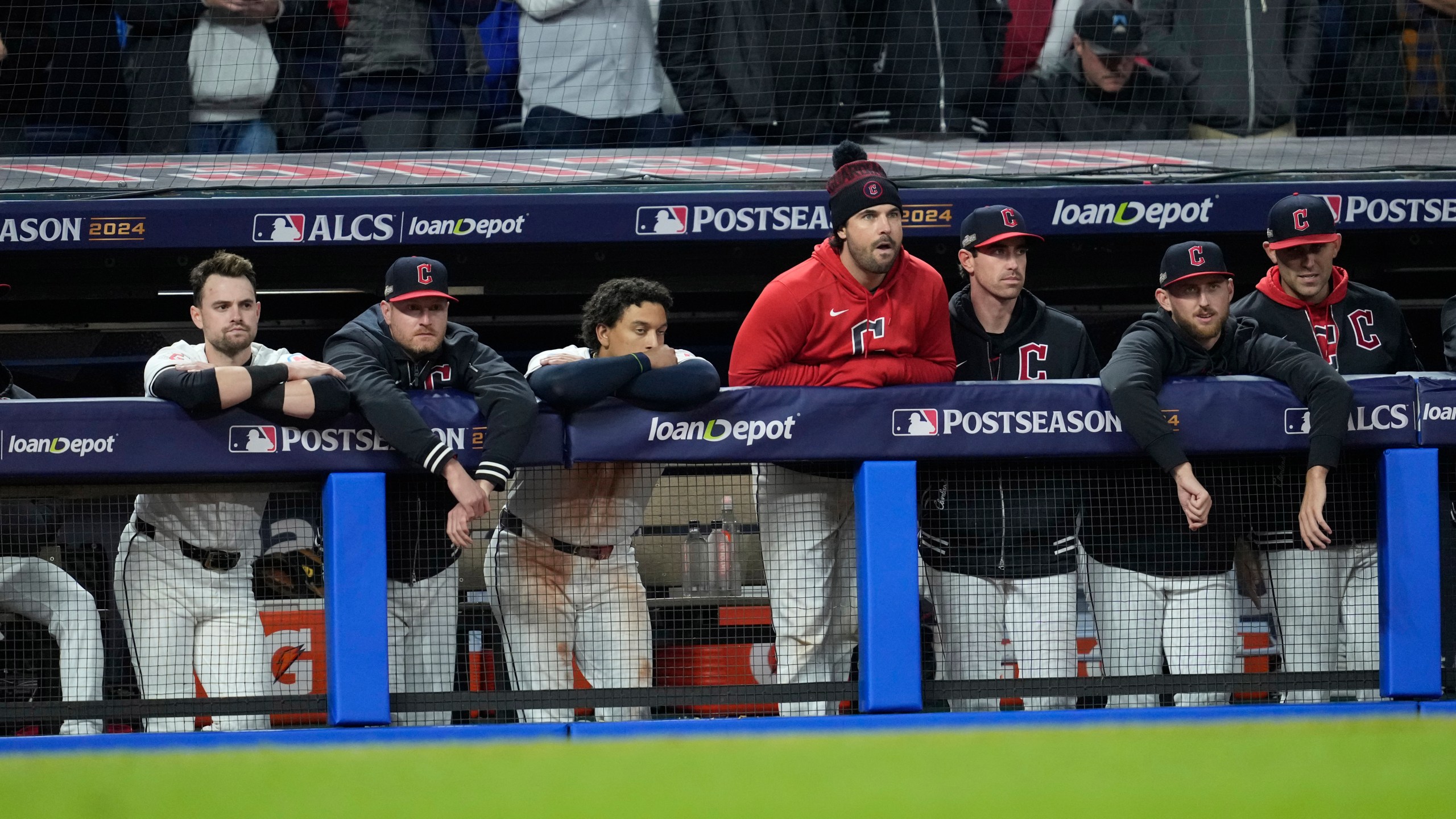 Cleveland Guardians players watch from the dugout during the ninth inning in Game 4 of the baseball AL Championship Series against the New York Yankees Friday, Oct. 18, 2024, in Cleveland. The Yankees won 8-6. (AP Photo/Godofredo A. Vásquez)