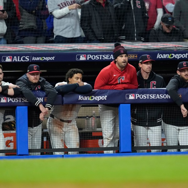 Cleveland Guardians players watch from the dugout during the ninth inning in Game 4 of the baseball AL Championship Series against the New York Yankees Friday, Oct. 18, 2024, in Cleveland. The Yankees won 8-6. (AP Photo/Godofredo A. Vásquez)