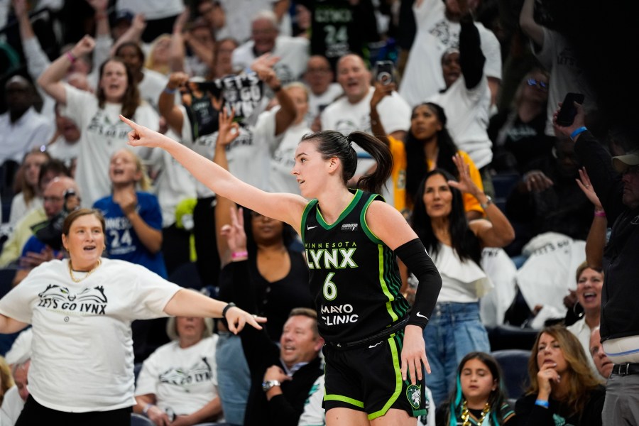 Minnesota Lynx forward Bridget Carleton (6) reacts to a 3-point basket against the New York Liberty during the second half of Game 4 of a WNBA basketball final playoff series, Friday, Oct. 18, 2024, in Minneapolis. (AP Photo/Abbie Parr)