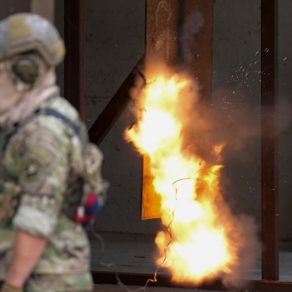 A U.S. special forces soldier sets off a reshaped explosive charge that's noticeably smaller to reduce its blowback on troops, Thursday, Sept. 19, 2024, at at Fort Liberty in Fayetteville, N.C. Special Operations Command is developing ways to better protect warfighters and evaluate their health risks, particularly during training. (AP Photo/Chris Carlson)