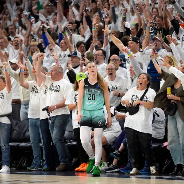 New York Liberty guard Sabrina Ionescu (20) reacts after missing a shot at the buzzer during the second half of Game 4 of a WNBA basketball final playoff series, Friday, Oct. 18, 2024, in Minneapolis. The Lynx won 82-80, forcing a Game 5 in the series. (AP Photo/Abbie Parr)