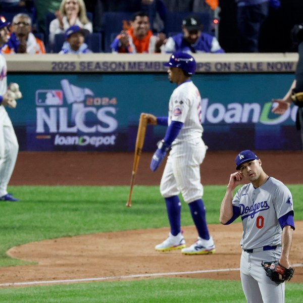 Los Angeles Dodgers pitcher Jack Flaherty reacts during the third inning in Game 5 of a baseball NL Championship Series against the New York Mets, Friday, Oct. 18, 2024, in New York. (AP Photo/Adam Hunger)