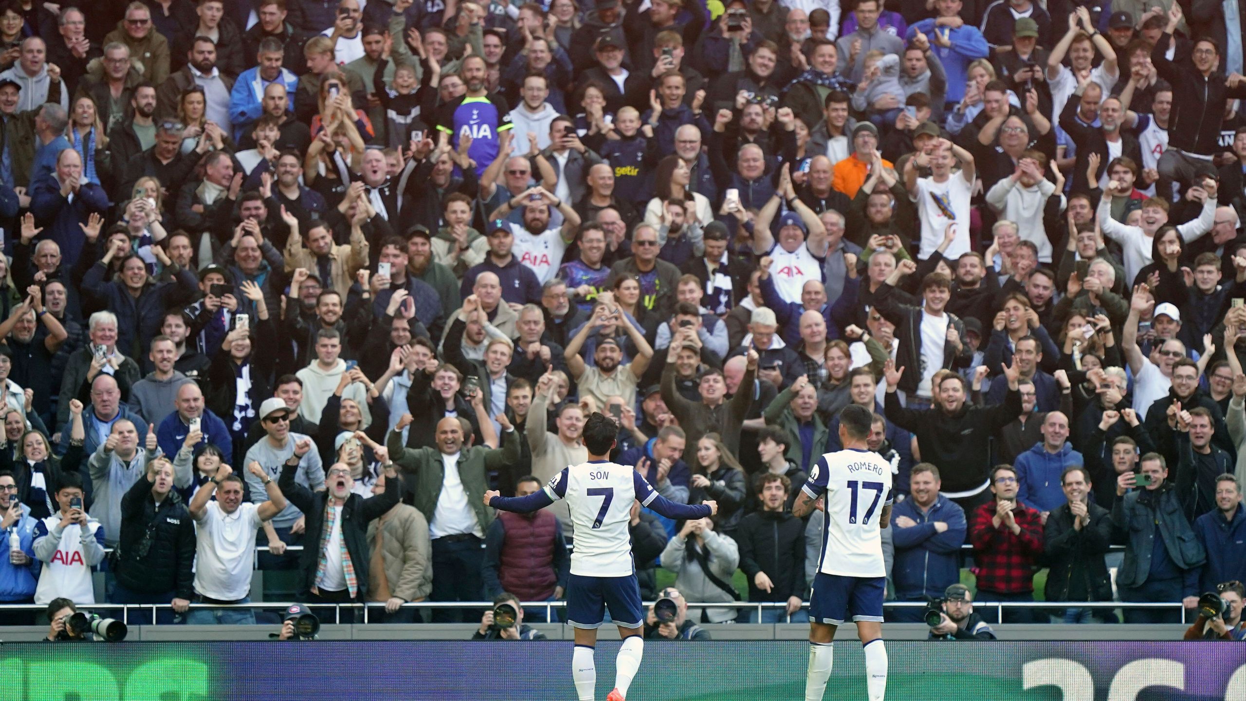 Tottenham Hotspur's Son Heung-Min, left, celebrates scoring with fans during the English Premier League soccer match between Tottenham Hotspur and West Ham United at the Tottenham Hotspur Stadium, London, Saturday Oct. 19, 2024. (Zac Goodwin/PA via AP)