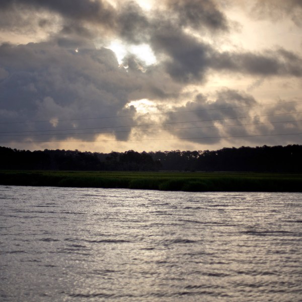 FILE - The sun rises over Sapelo Island, Ga., a Gullah-Geechee community, on June 10, 2013. (AP Photo/David Goldman, File)