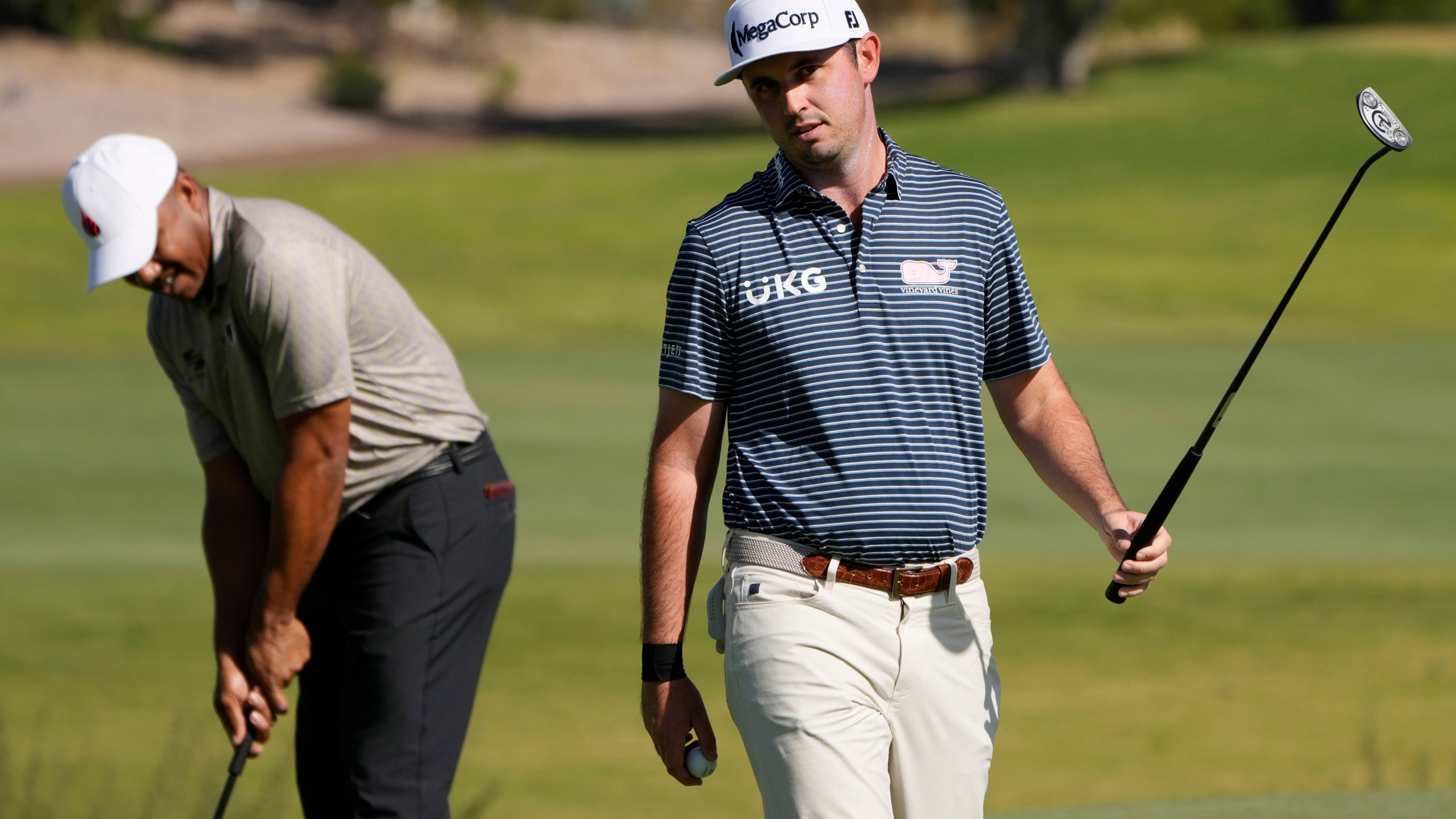 J.T. Poston reacts after sinking a putt on the third green during the first round of Shriners Children's Open golf tournament Thursday, Oct. 17, 2024, in Las Vegas. (AP Photo/John Locher)