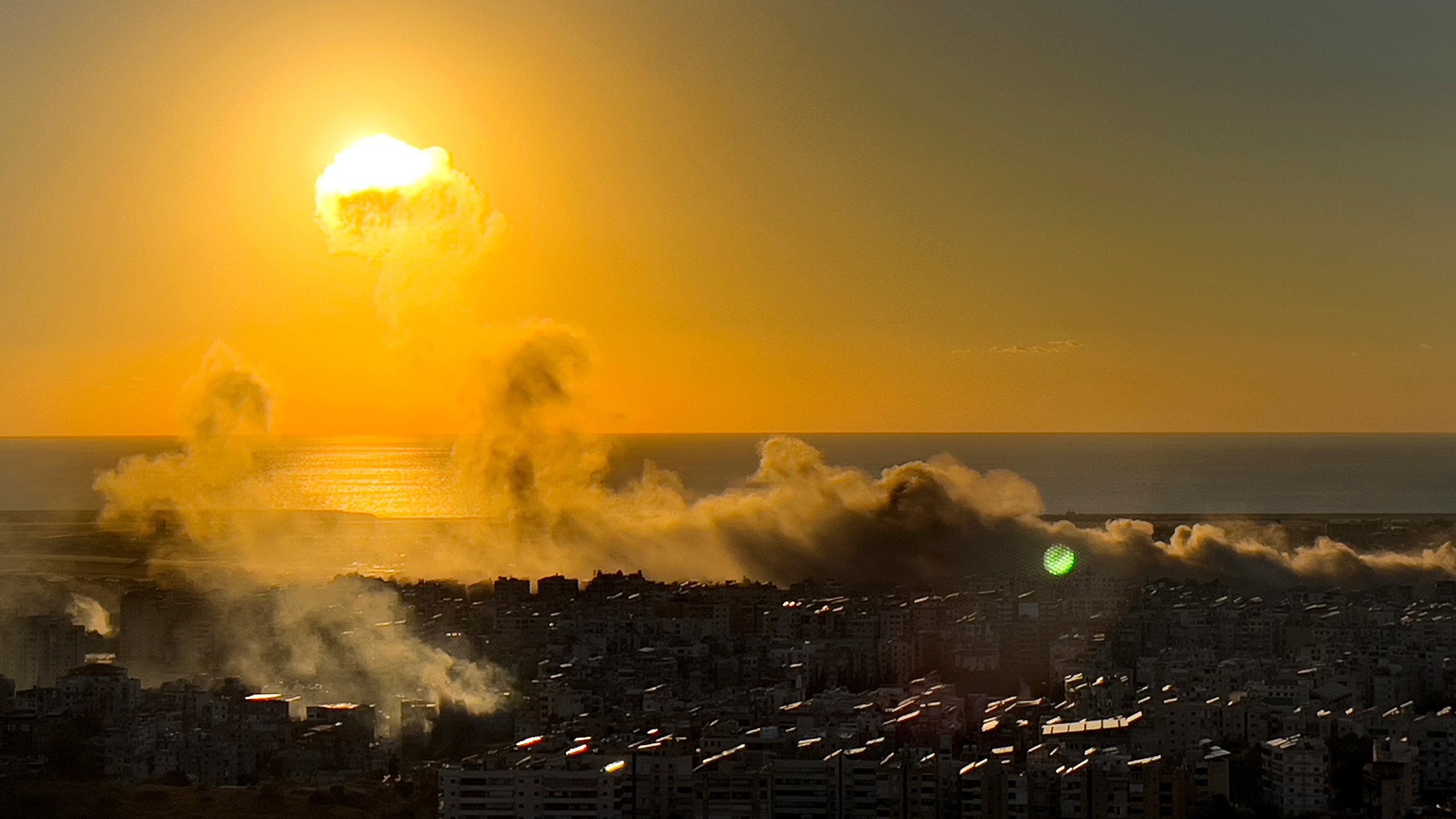 Smoke rises from Israeli airstrikes on Dahiyeh, as the sunset in the southern suburb of Beirut, Lebanon, Saturday, Oct. 19, 2024. (AP Photo/Hussein Malla)