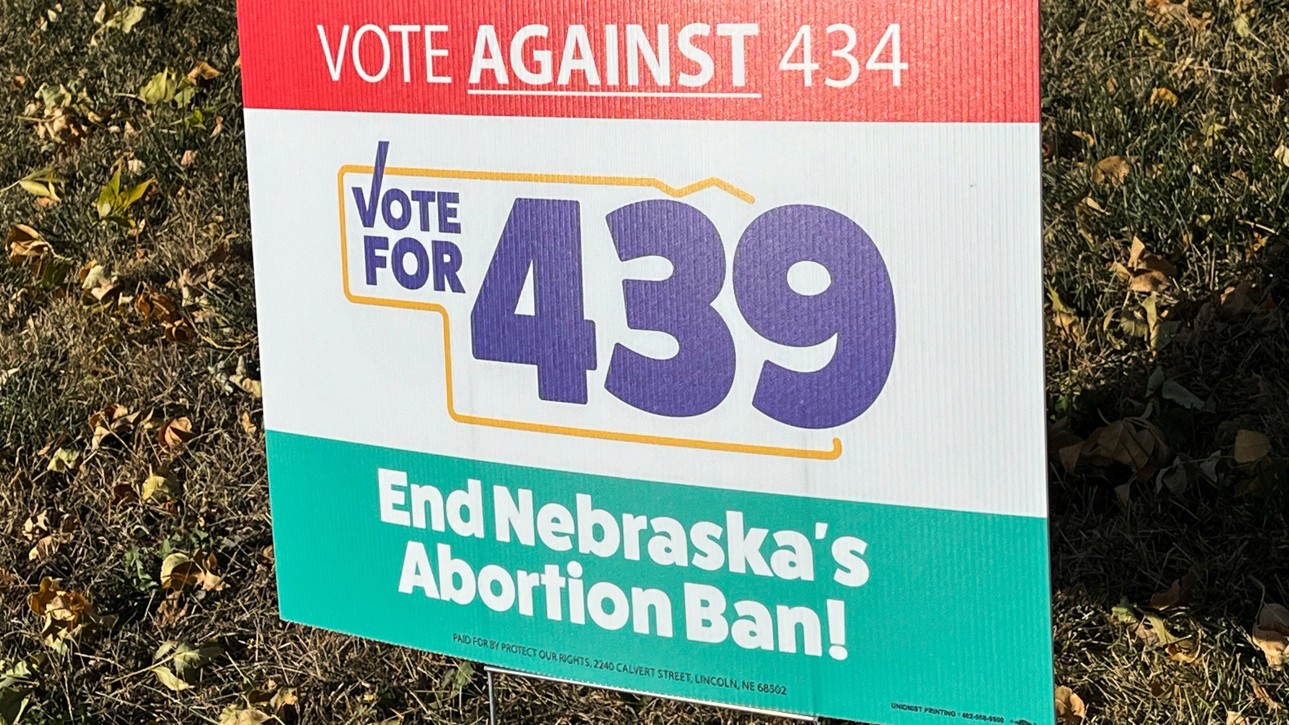 A sign supporting a ballot measure to expand abortion rights is seen in a yard, Friday, Oct. 18, 2024, in Omaha, Neb. (AP Photo/Margery Beck)