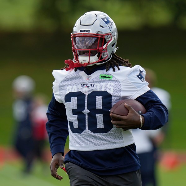 New England Patriots running back Rhamondre Stevenson (38) takes part in drills during NFL football practice, Friday, Oct. 18, 2024, in Harrow, England. (AP Photo/Steve Luciano)