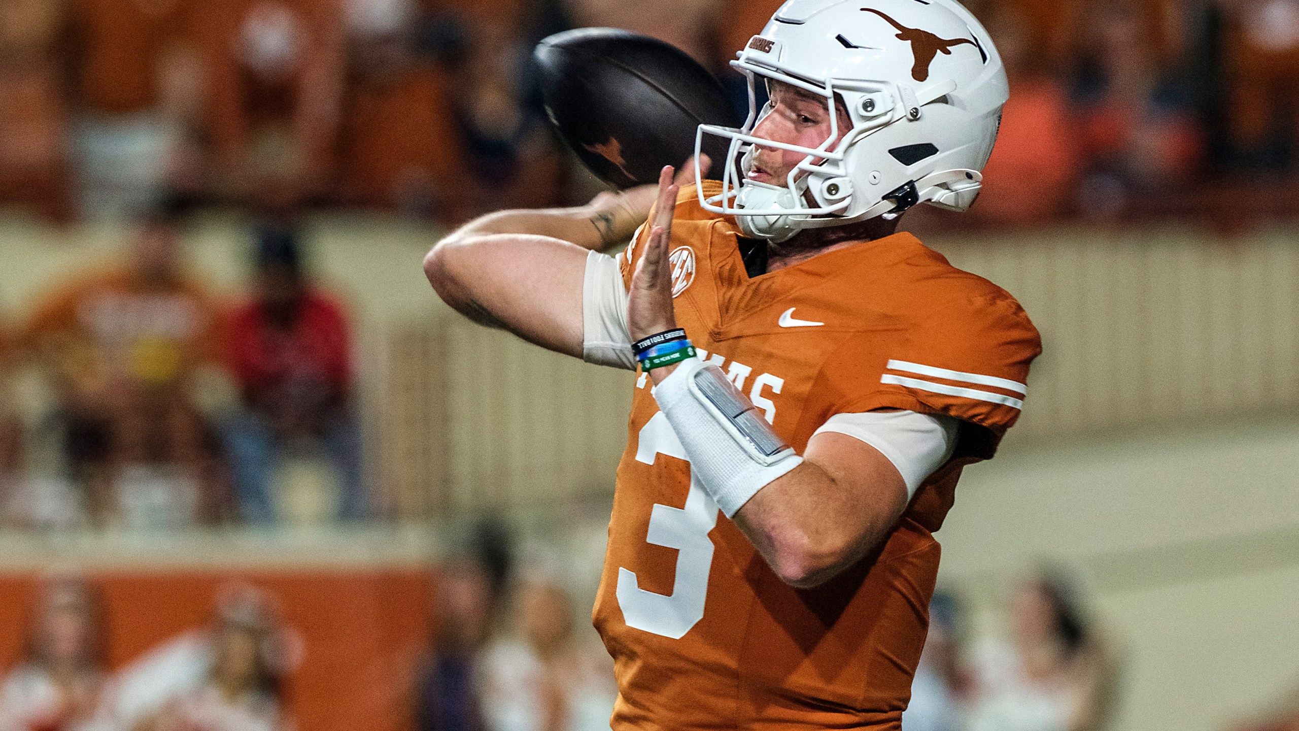 Texas quarterback Quinn Ewers (3) throws down field against Georgia during the first half of an NCAA college football game in Austin, Texas, Saturday, Oct. 19, 2024. (AP Photo/Rodolfo Gonzalez)