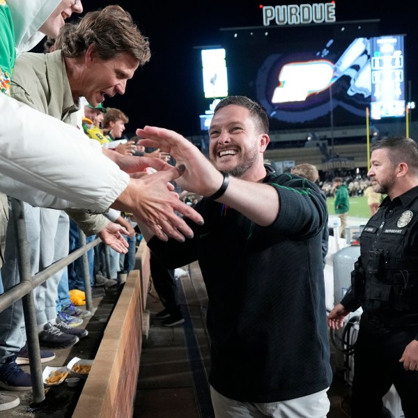 Oregon head coach Dan Lanning celebrates with fans after his team defeated Purdue in an NCAA college football game in West Lafayette, Ind., Friday, Oct. 18, 2024. (AP Photo/AJ Mast)