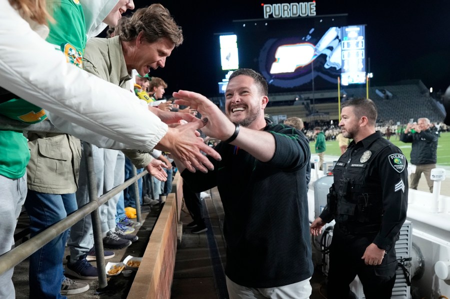 Oregon head coach Dan Lanning celebrates with fans after his team defeated Purdue in an NCAA college football game in West Lafayette, Ind., Friday, Oct. 18, 2024. (AP Photo/AJ Mast)