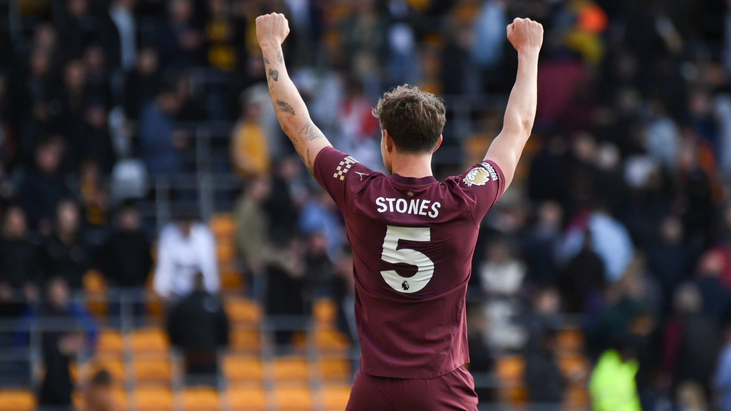 Manchester City's John Stones celebrates after the VAR confirmed his side's second goal during the English Premier League soccer match between Wolverhampton Wanderers and Manchester City at the Molineux Stadium in Wolverhampton, England, Sunday, Oct. 20, 2024. (AP Photo/Rui Vieira)